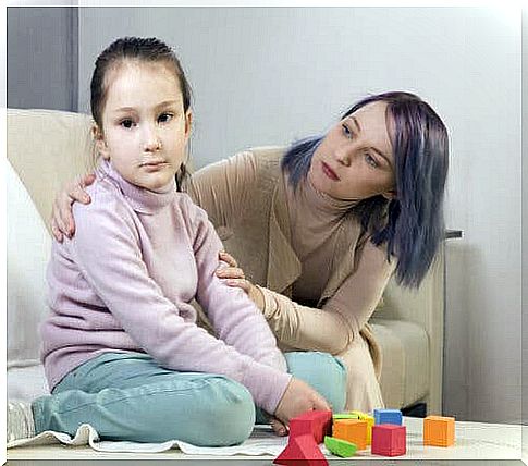 An autistic child with her mother on an educational intervention program