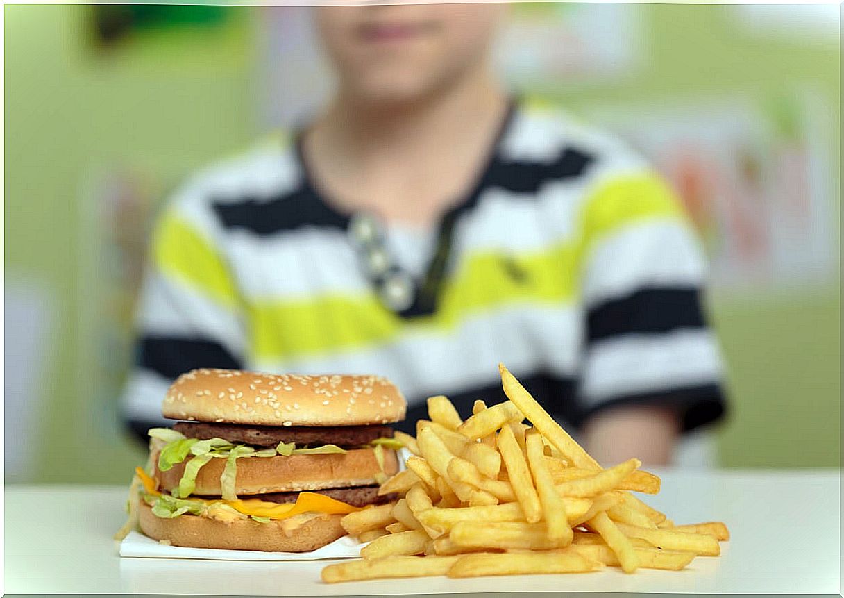 Child eating junk food.