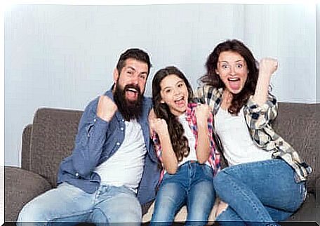 A family having fun on their sofa.