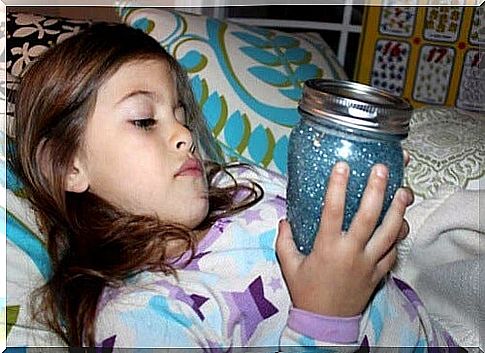 A concentrated little girl with her cool down bottle 