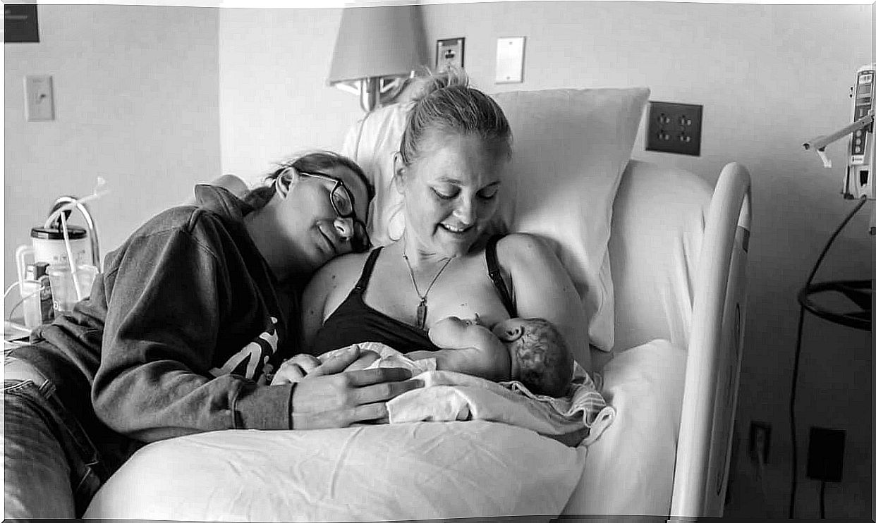 A mother who has just given birth is breastfeeding her baby 