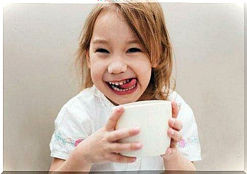 A girl enjoying a cup of coffee