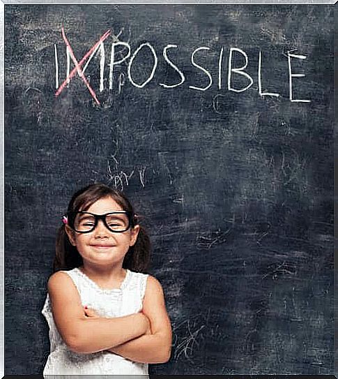 child in front of a blackboard 