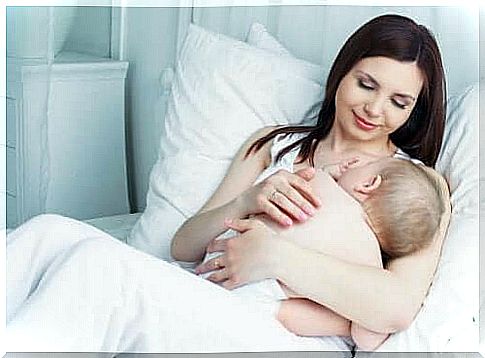 A mother breastfeeding her baby. 