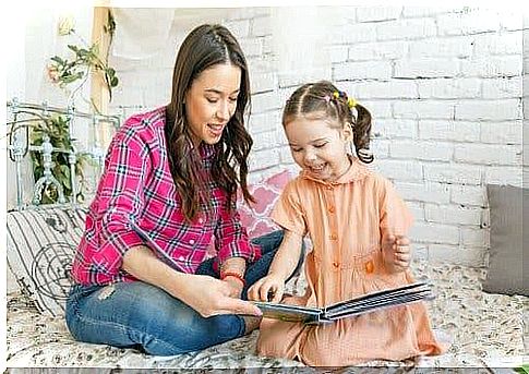 A mother reading a fairy tale to her daughter