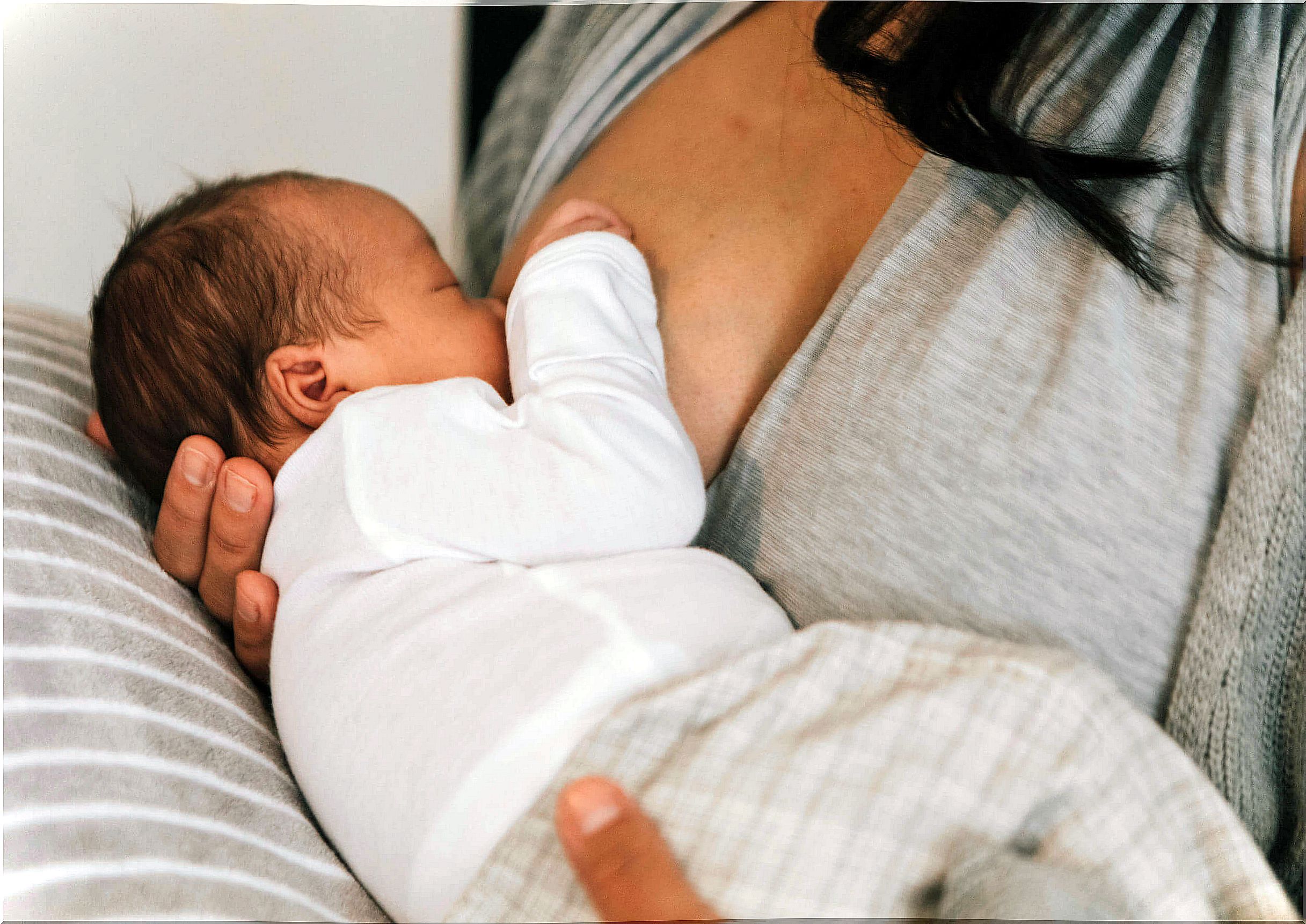 Mother breastfeeding her baby.