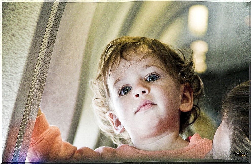 A child in a plane.