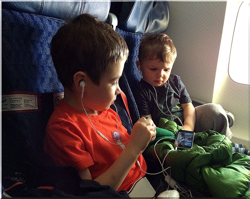 Two children in a plane.