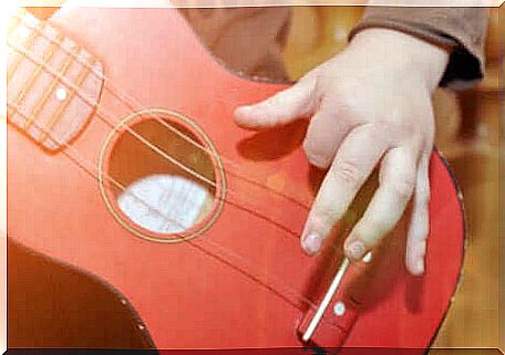 A child playing the guitar.