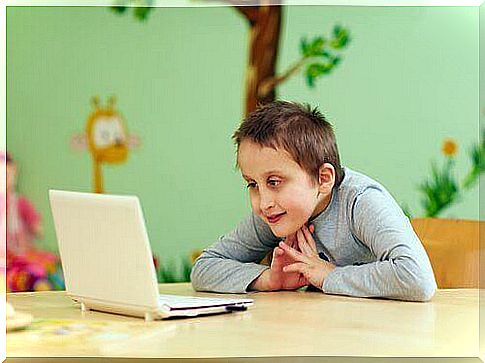 A child in front of a screen.