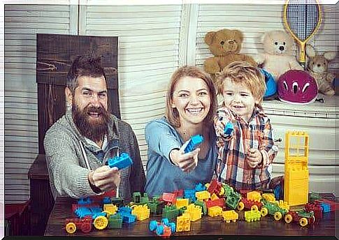 A family playing Legos.