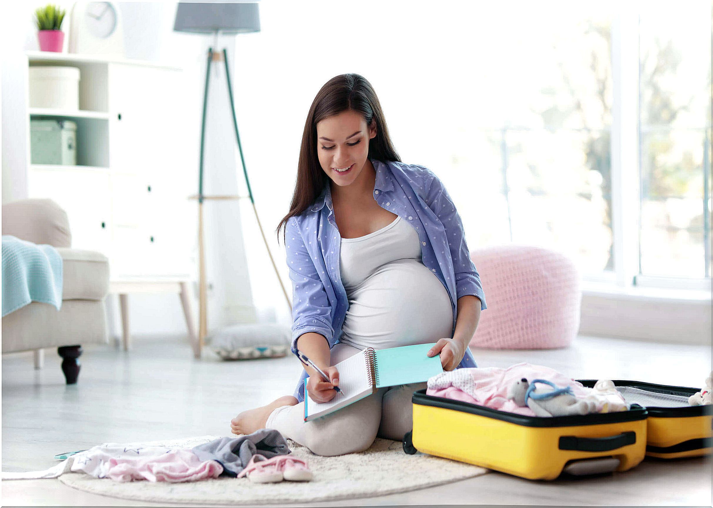 Pregnant woman preparing bag for hospital in week 36.