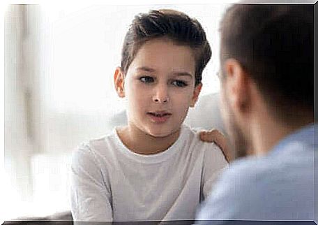 A father and his son chatting.