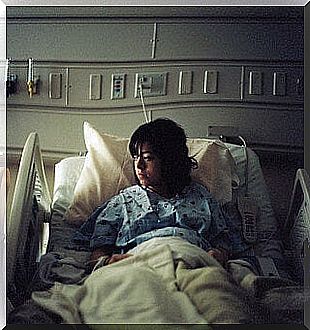 Pregnant woman waiting for childbirth in her hospital bed