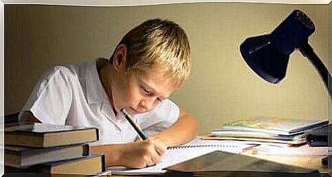 A child studying on a desk